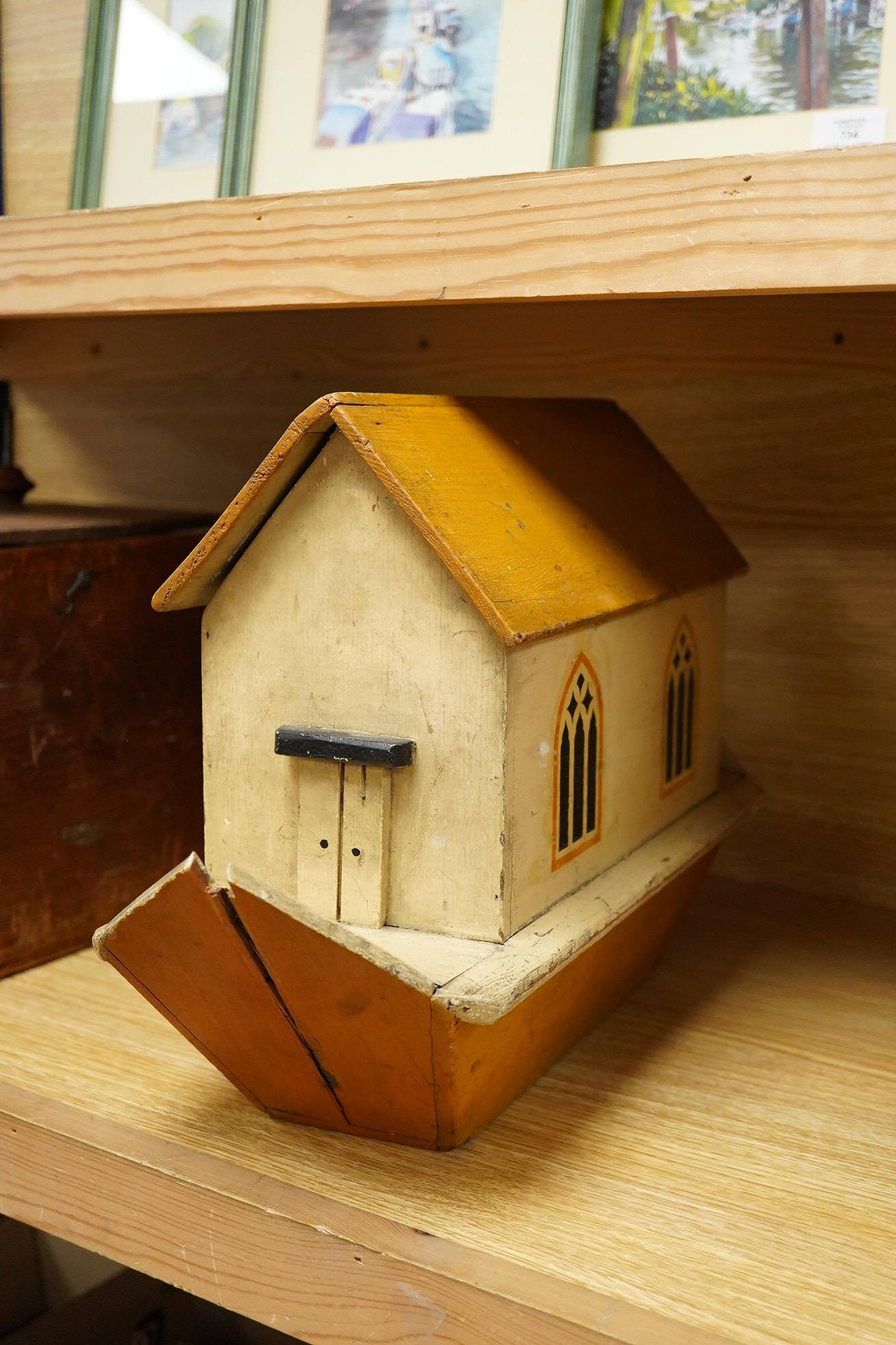 A First World War ‘War Relief Toy Work’ painted pine Noah's Ark with a quantity of carved and painted wooden animals, the ark with hinged lid, label pasted to the inside of the lid stating; Made in England, with a biblic